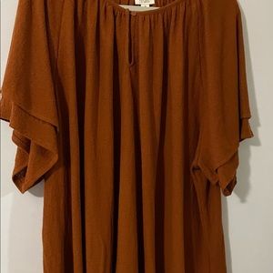 ANA flounce top with bell sleeves.